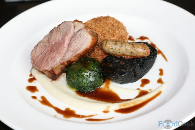 Lamb rump, herb sausage, black pudding, sweet potato cake, artichoke puree, garlic jus